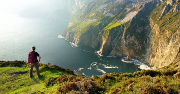 Man standing looking at Sieve league mountain peek